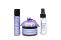 Set of lavender-themed products including a bottle, a jar, and a spray bottle on a white background.