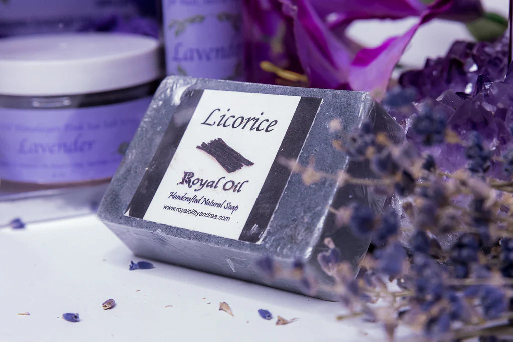 Bar of soap with a label on a white surface with lavender flowers.
