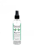 Bottle of Peppermint Royal Oil with a green label on a white background