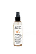 Bottle of Lemon Royal Oil body spray on a white background