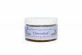 Jar of unscented Himalayan pink salt scrub with a white lid on a white background