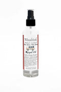 Bottle of Woodstock Bath & Body Products Royal Oil on a white background