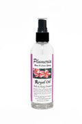 Bottle of Plumeria Royal Oil with floral design on a white background
