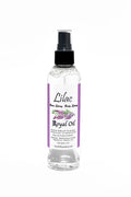 Bottle of Lilac Royal Oil with a spray nozzle on a white background