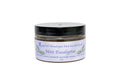 Jar of Mint Eucalyptus scrub with a white label on a white background