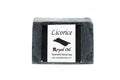 Black licorice soap bar with a white label on a white background