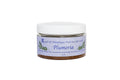 Jar of Plumeria body scrub with a white lid on a white background
